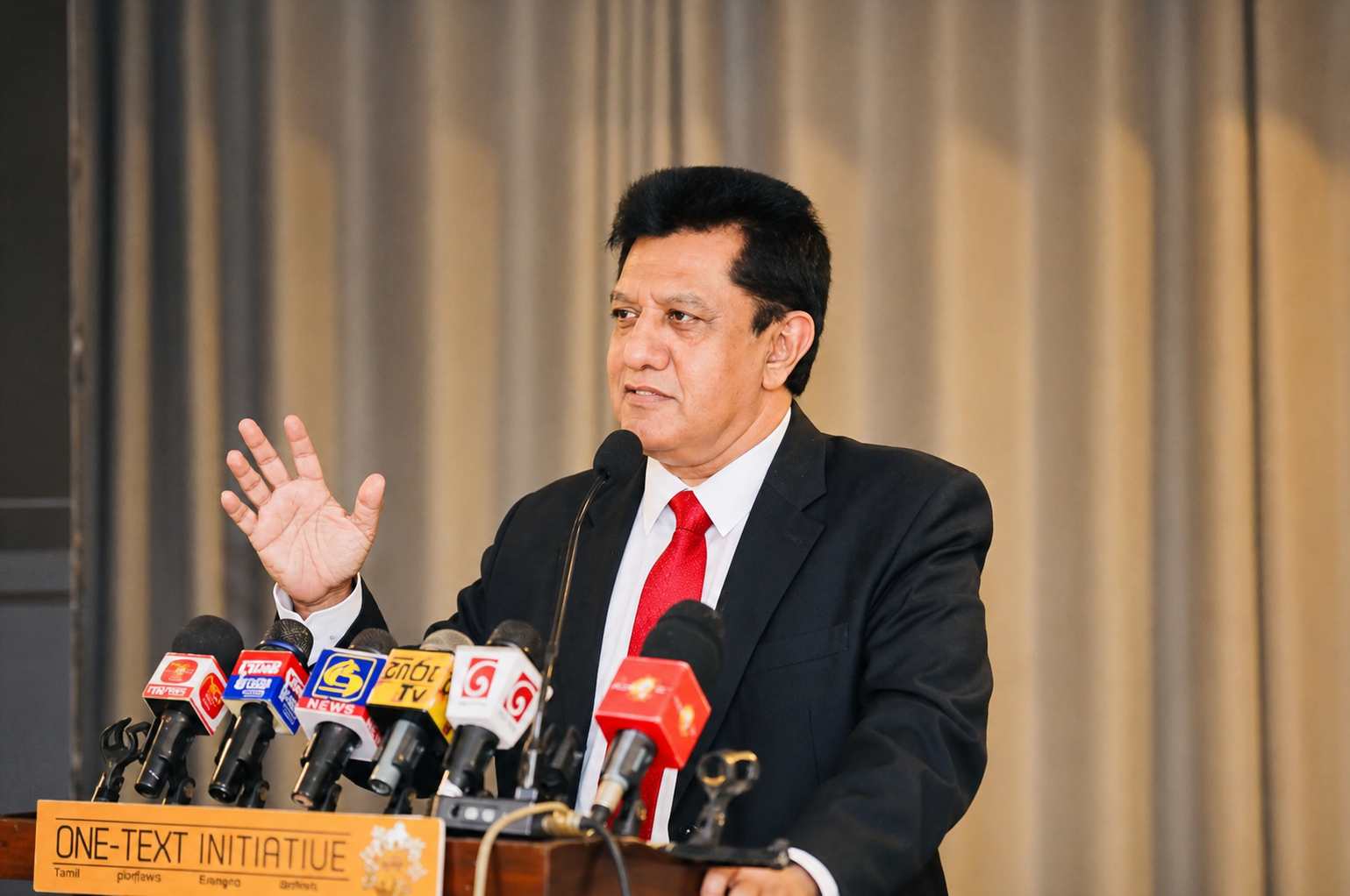 Professor Charitha Herath speaking at a press conference
