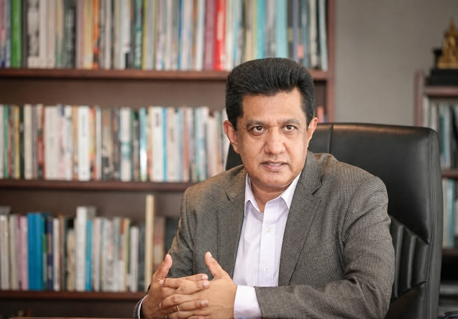 Professor Charitha Herath in his study surrounded by books
